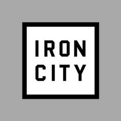 A square black and white logo with the words iron city underneath.