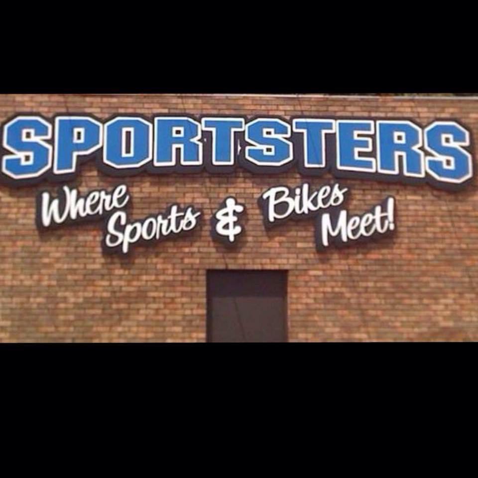 A brick wall with the word " sportsters where sports and bikes meet ".