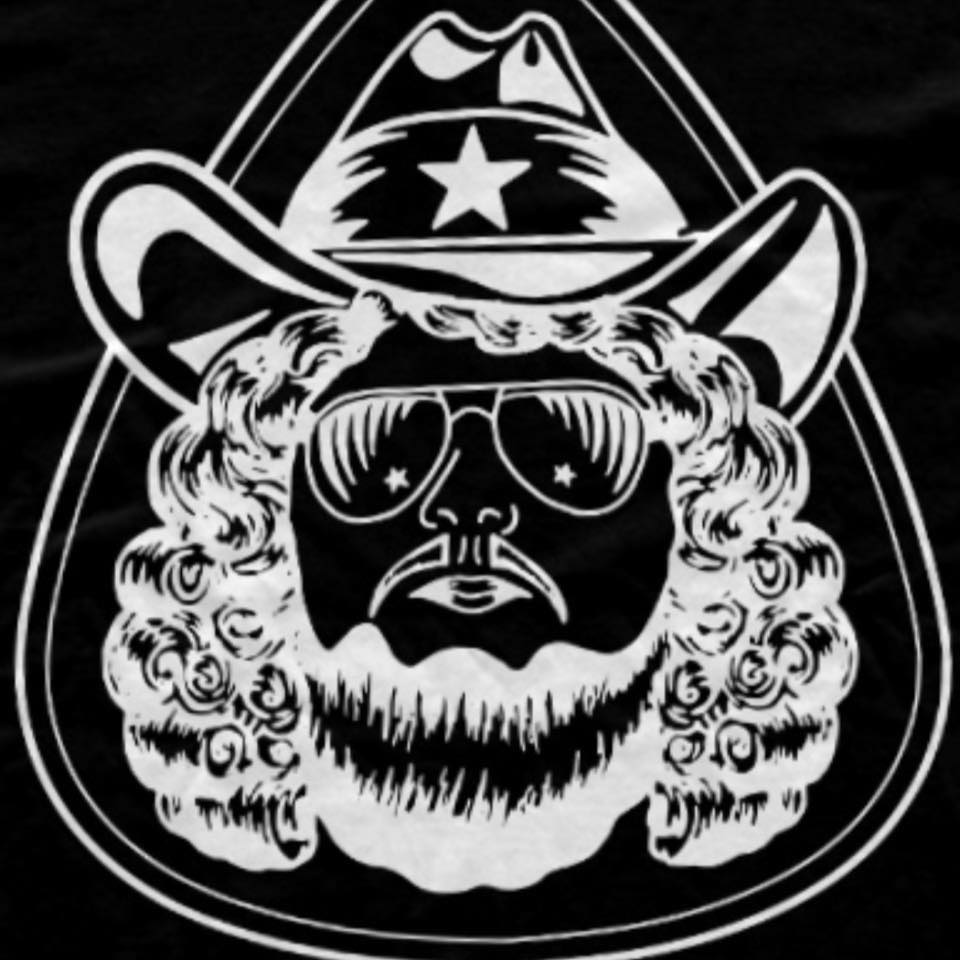 A black and white image of a cowboy wearing sunglasses.